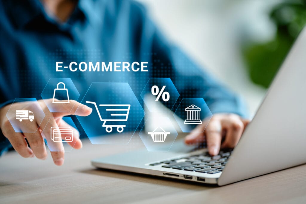 Woman using laptop with superimposed virtual interface of ecommerce icons