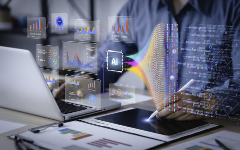 Data scientist uses a computer and tablet for analysis of enterprise media information using AI