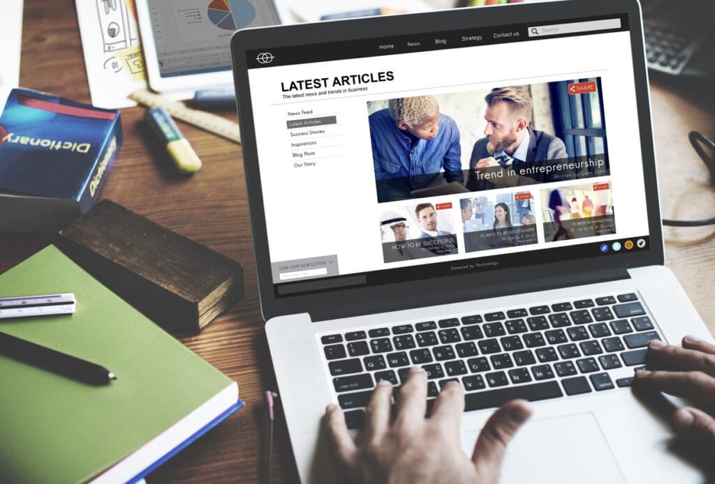 AI + WordPress: Cropped shot of a person checking a laptop to publish the latest articles.