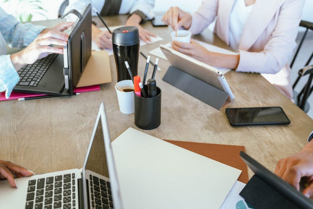 AI + WordPress: A publishing team working on different devices on an office table